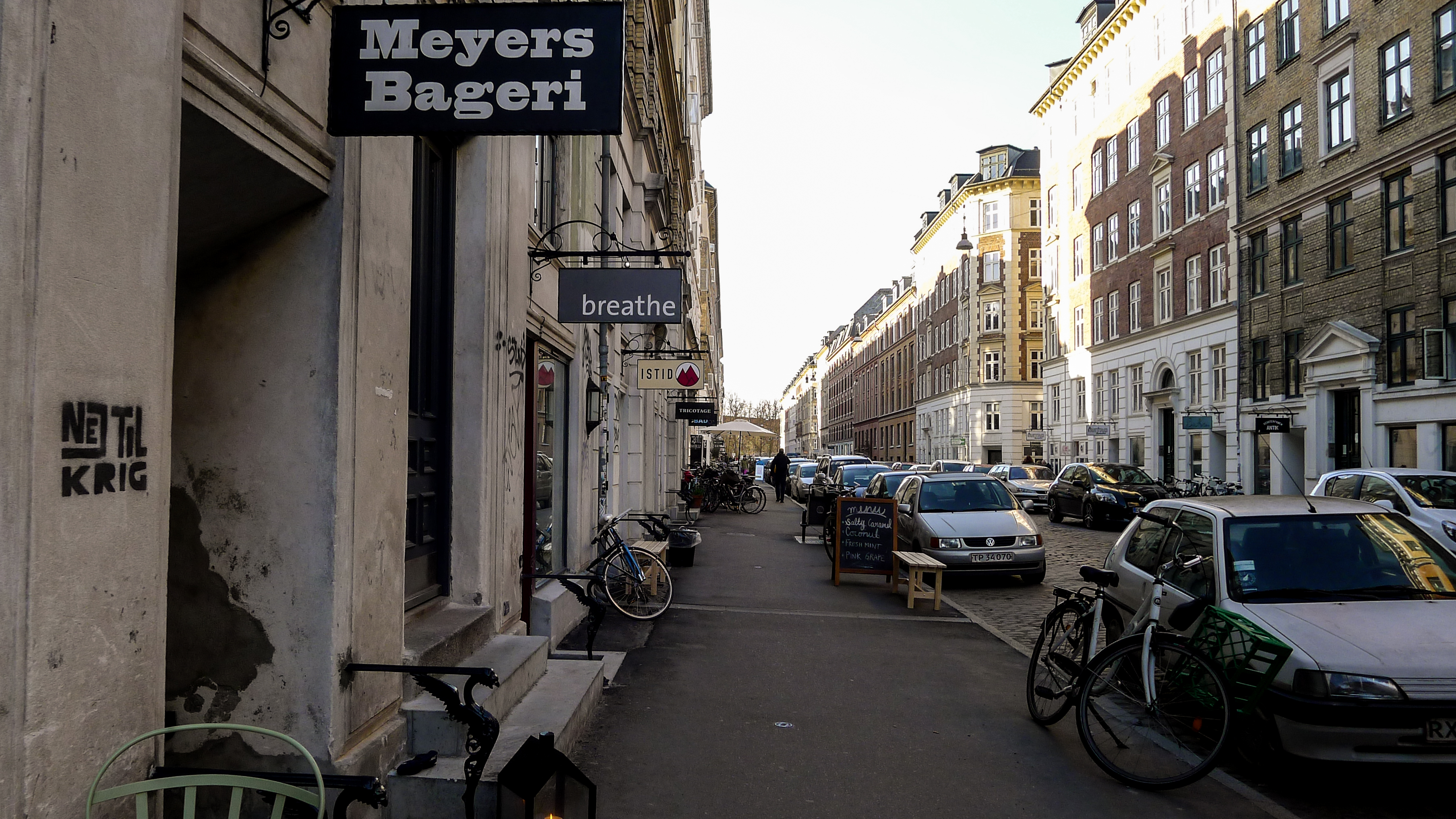 Shopfronts, bicycles and residents on Jægersborggade